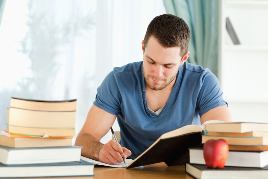 Male student working through his books-1.jpeg