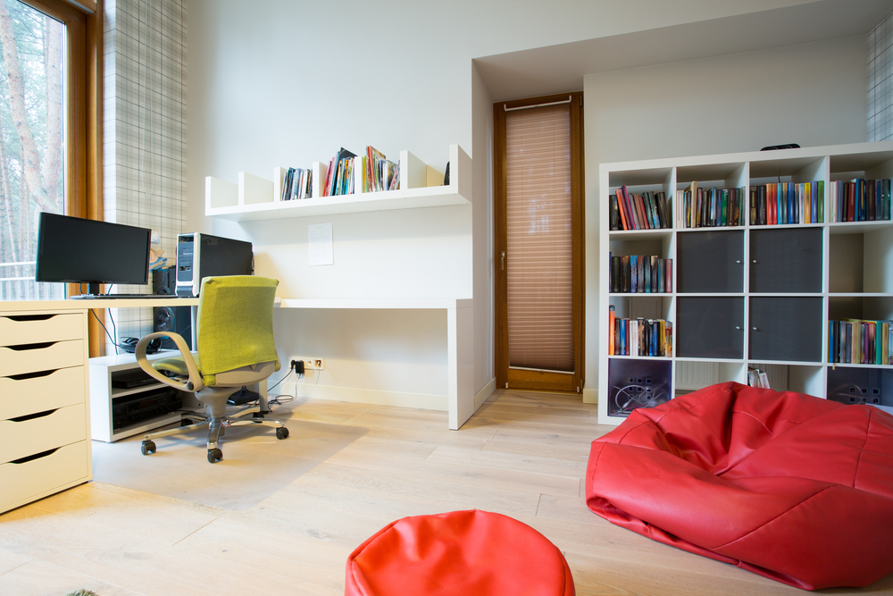 Modern spacious study room with red bag chair