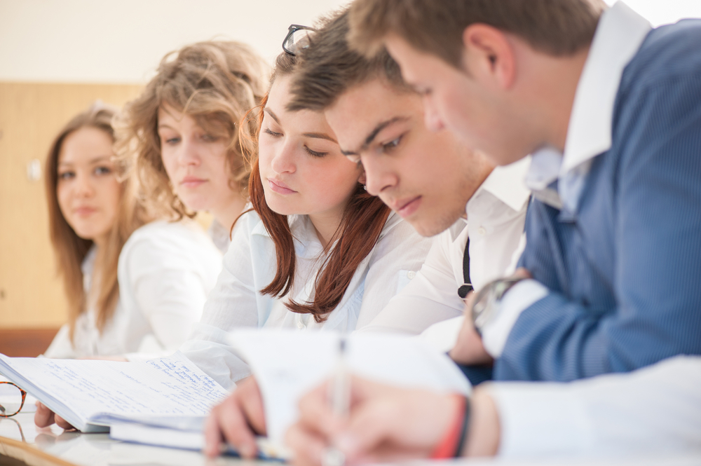 High school students sitting and reading together-1